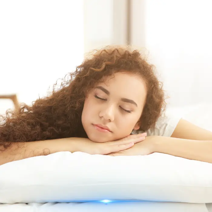 girl sleeping on pillow