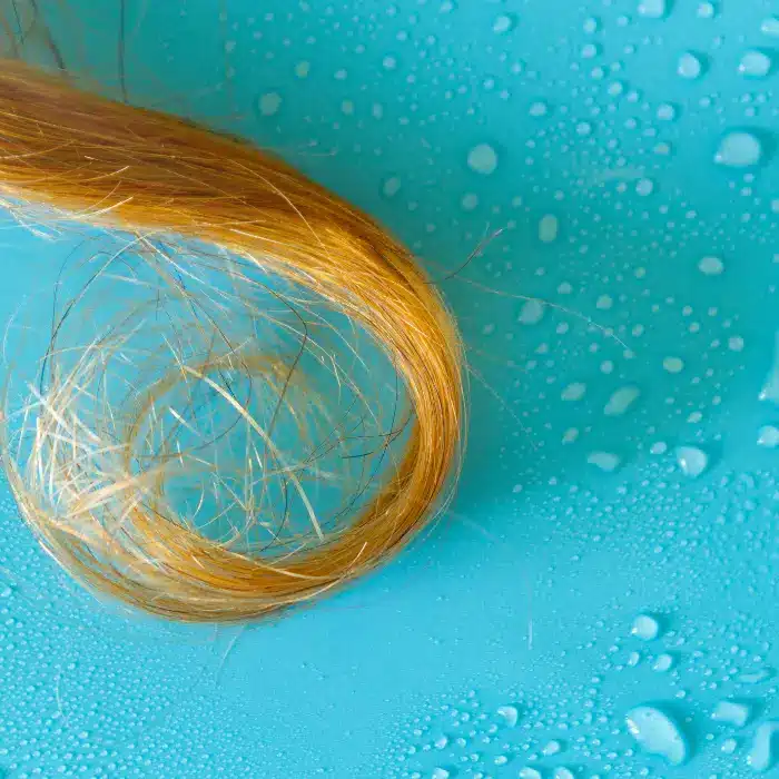 hair strand with water drops on surface