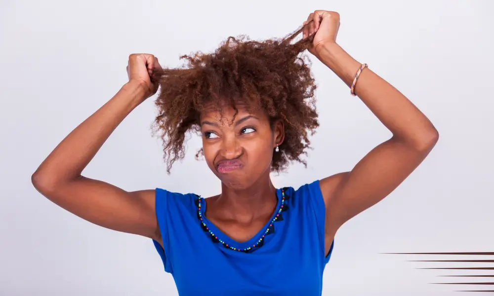 a girl with frizzy curly hair